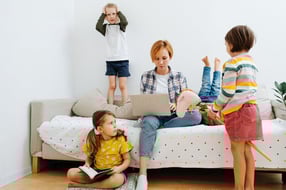 bunch-kids-play-around-their-mom-sitting-couch-working-her-laptop-each-doing-his-her-own-thing-bunch-kids-play-259707254